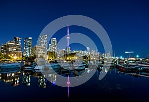 Toronto city skyline at Night fromÂ Marina Quay West, Ontario, Canada